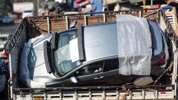 Loading car into carriers